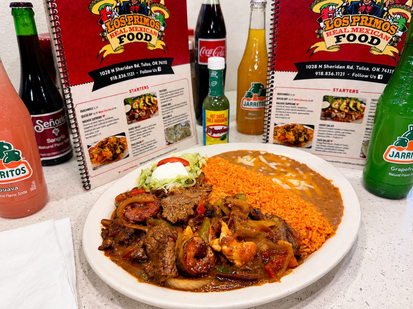 Ranchero Mix with steak, chicken, and shrimp in spicy salsa at Los Primos