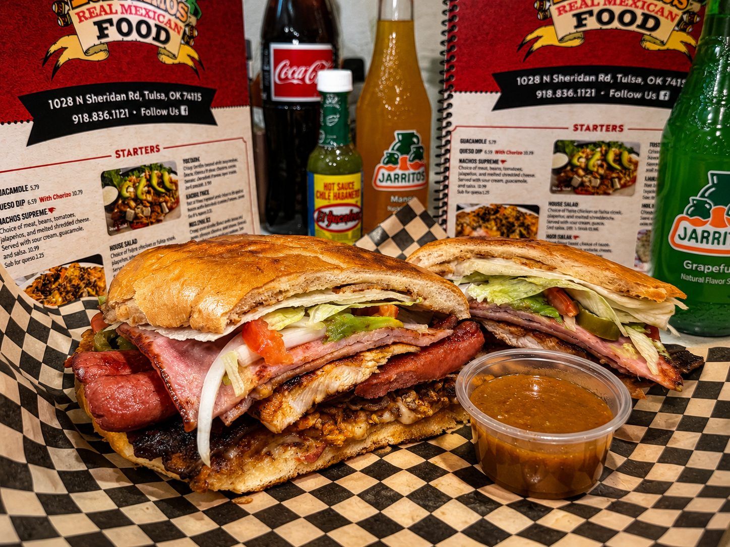 Torta Cubana loaded with steak, chorizo, chicken, ham, and sausage at Los Primos